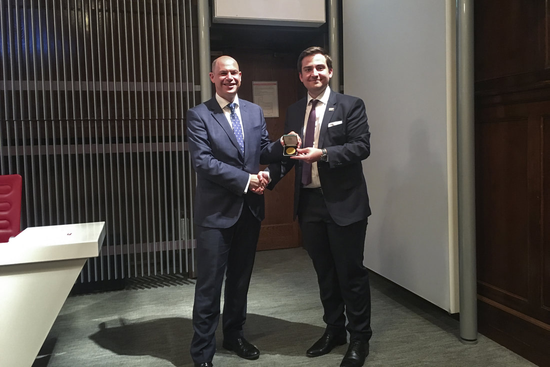 Air Cmd Paul Lloyd of the RAF & MoD (left), presenting the medal to Chris Triantafyllou (right) during the annual meeting of the aerospace division in London